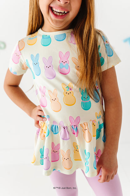 Child wearing a top with colorful PEEPS®  print on a white background