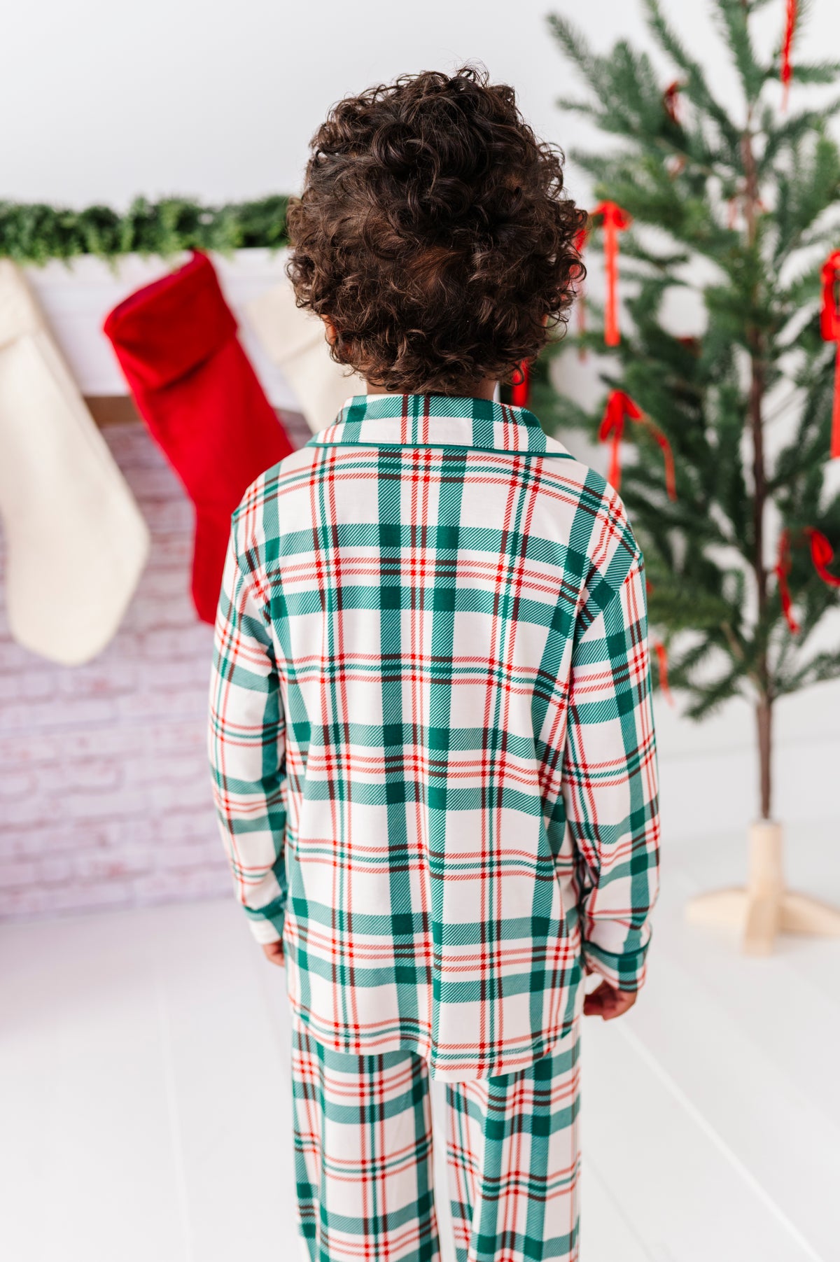 The back view of a classic Christmas plaid pajama in red, green, and cream 