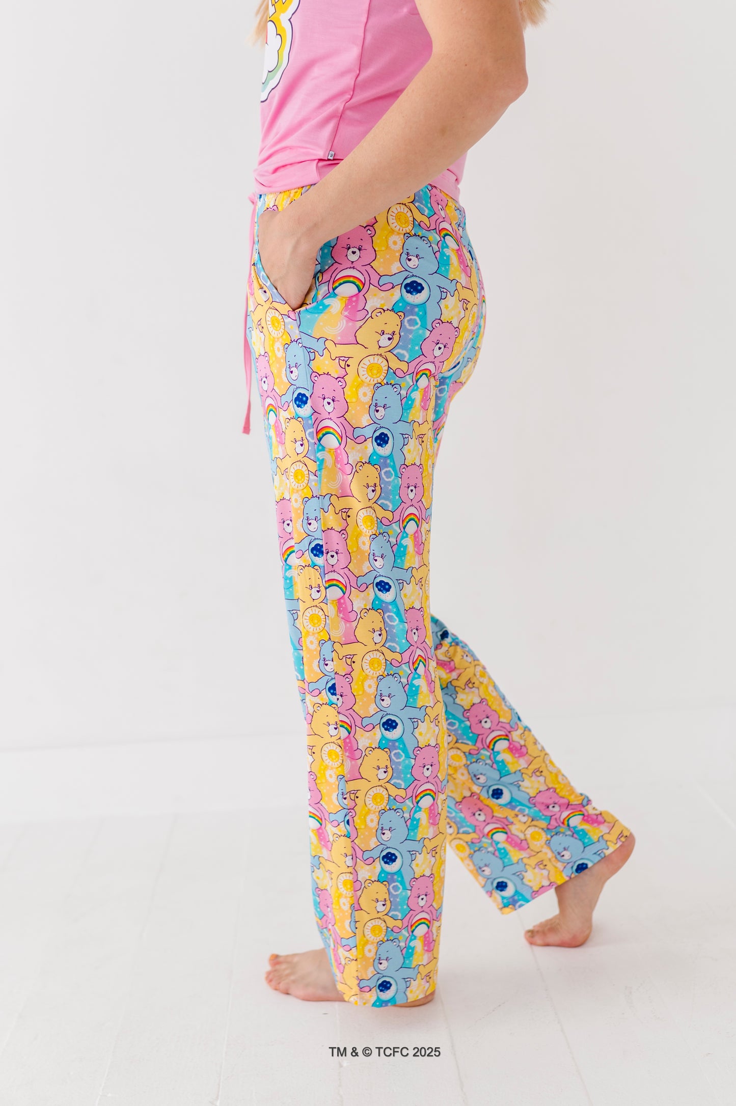 Close-up of women’s Care Bears bamboo pajama pants featuring colorful allover bear print