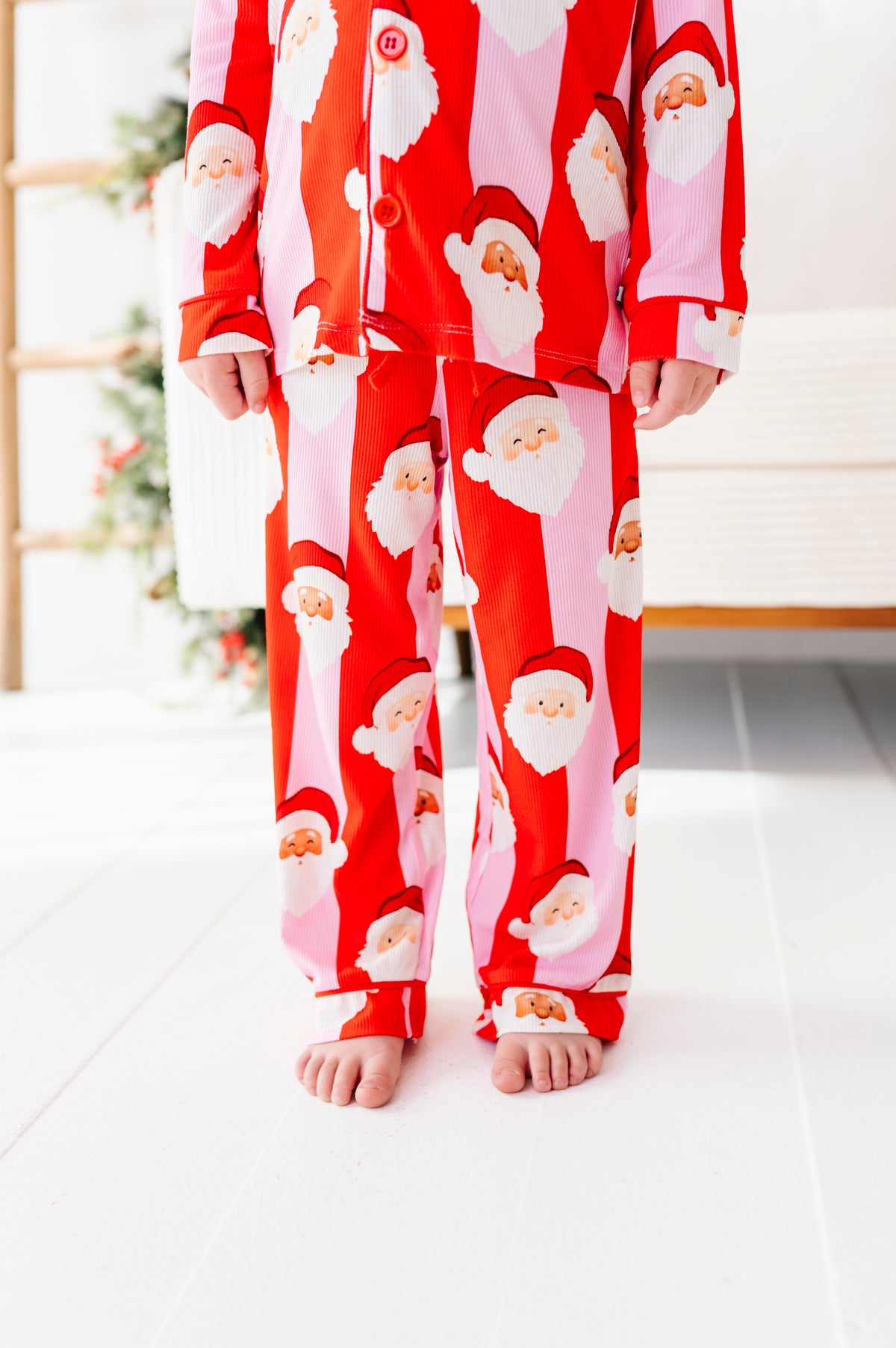 Close-up detail shot of red-and-pink bamboo lounge set. The set features buttons and pockets 