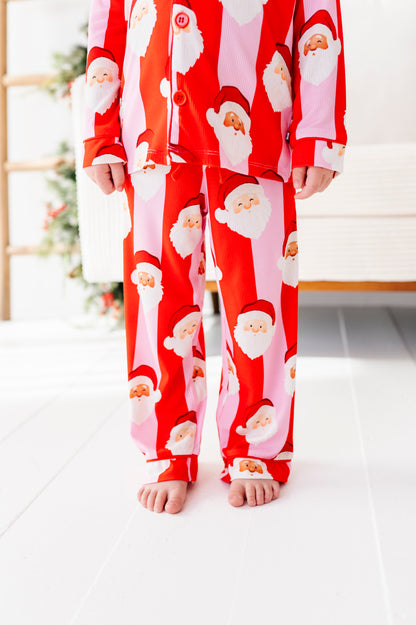 Close-up detail shot of red-and-pink bamboo lounge set. The set features buttons and pockets 
