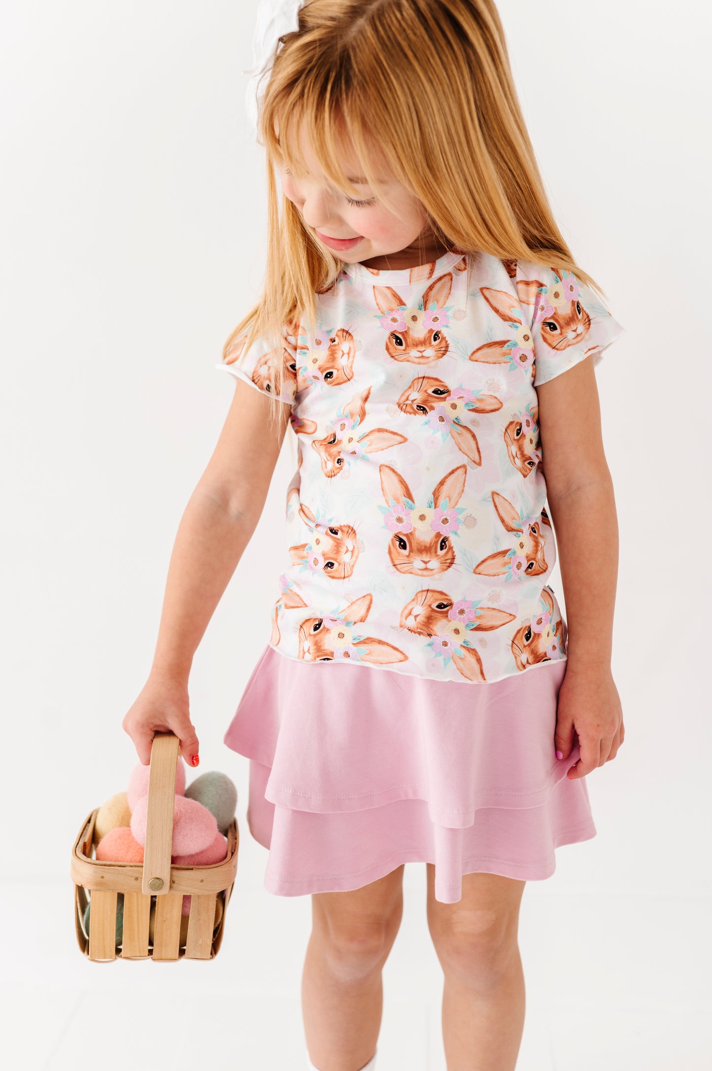 Young girl wearing a bunny Easter print tee with a lilac two-tier skort 