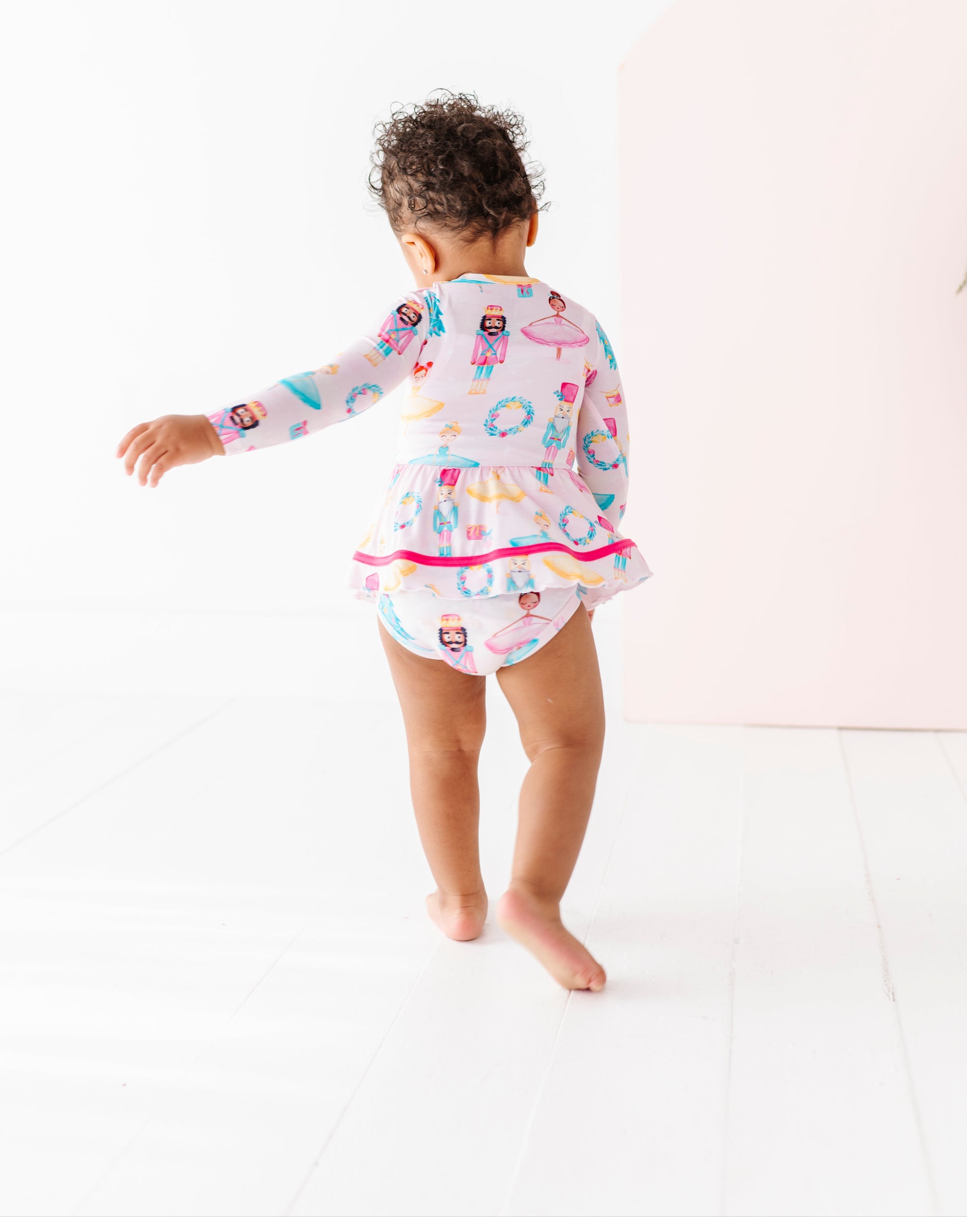 Sugarplum Birdie Twirl baby dress featuring ballerinas, wreaths, and Christmas trees