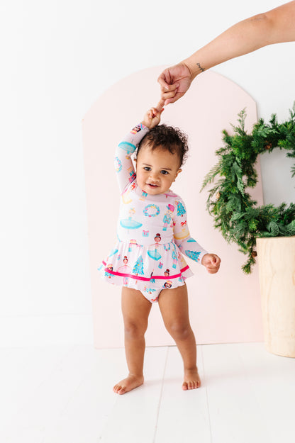 Baby in a holiday dress made from bamboo viscose with tiered twirl skirt