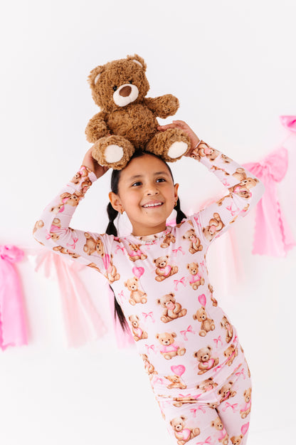 Child wearing Pink Beary Sweet ribbed bamboo pajamas with teddy bear and heart print