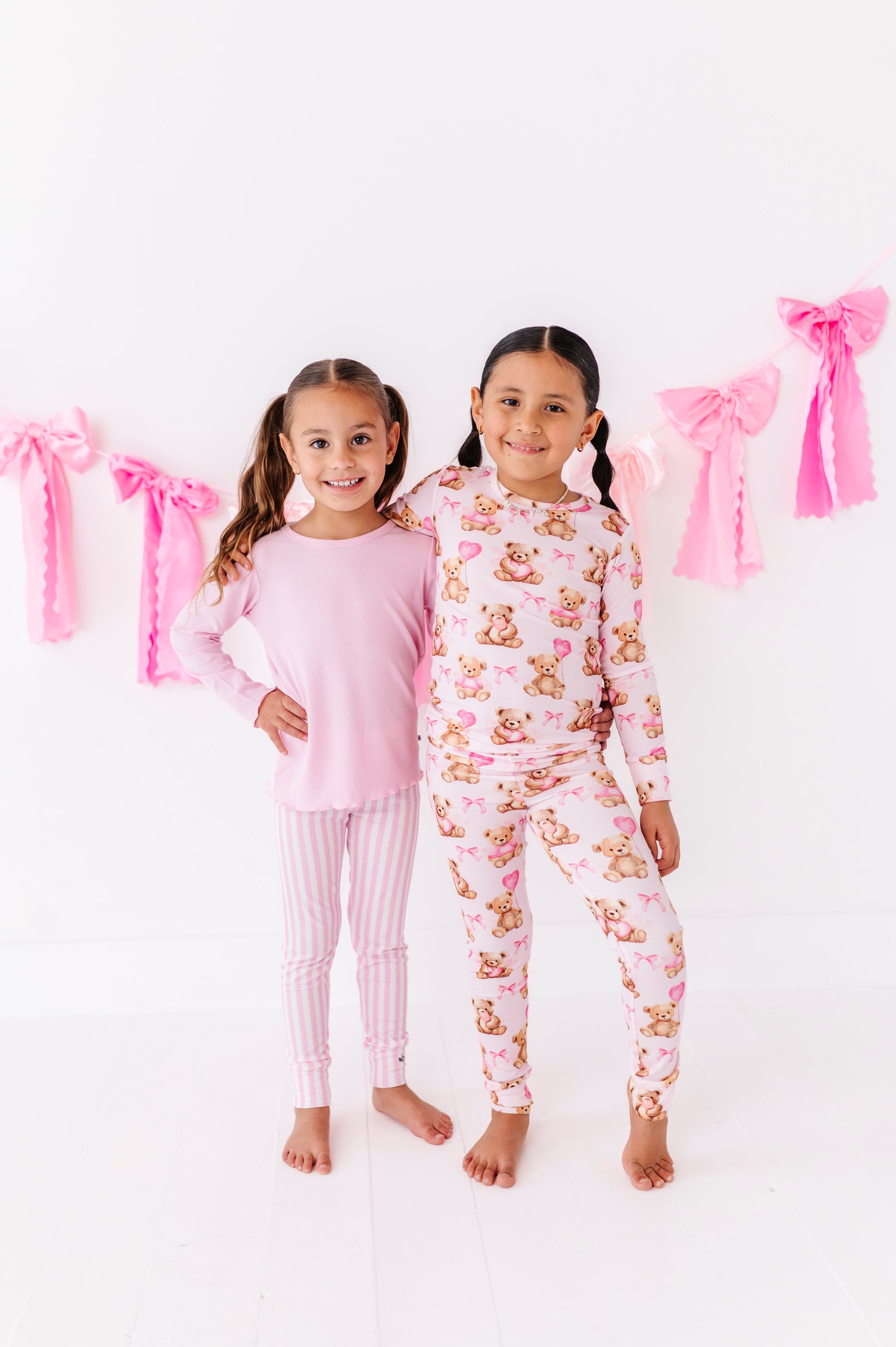 Pink ribbed lettuce hem top styled with striped leggings for girls