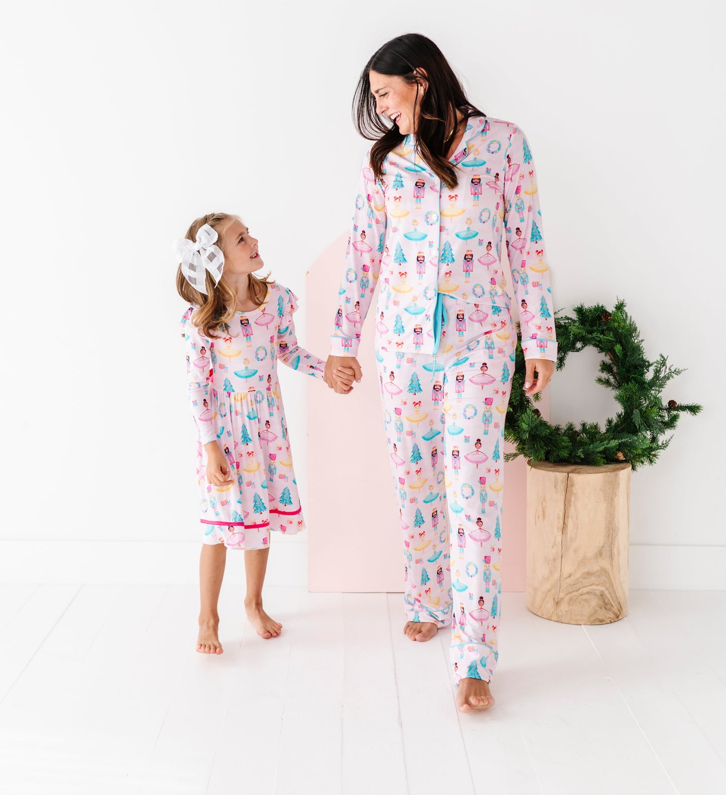 Woman and child wearing matching Christmas bamboo pajamas 