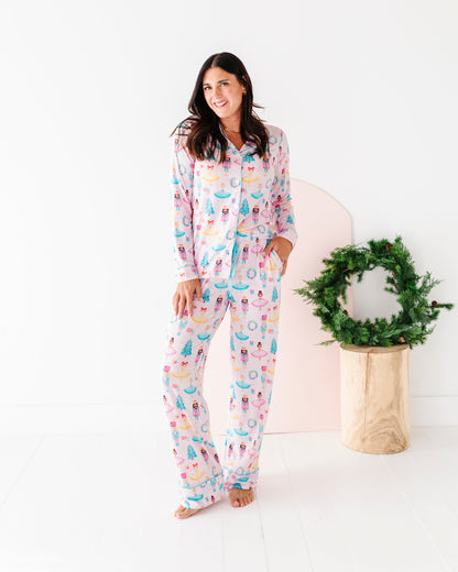 Woman wearing festive bamboo pajamas with a wreath in the background