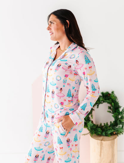 Woman wearing light pink bamboo pajamas with a Christmas theme 