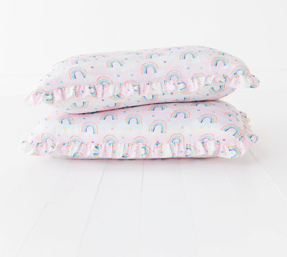 Two bamboo pillowcases with rainbow watercolor pattern on a white background