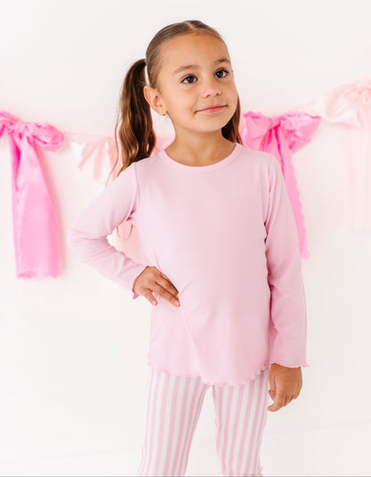 Pink stripe ribbed leggings styled for lounging and movement