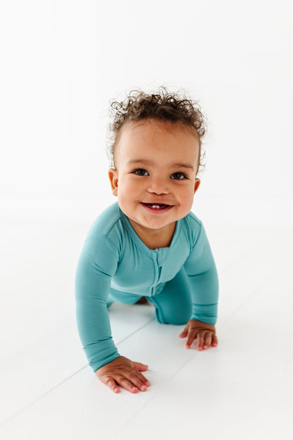Baby wearing slate convertible bamboo romper with 2-way zipper