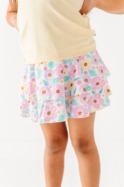 Floral skort worn by a person on a white background