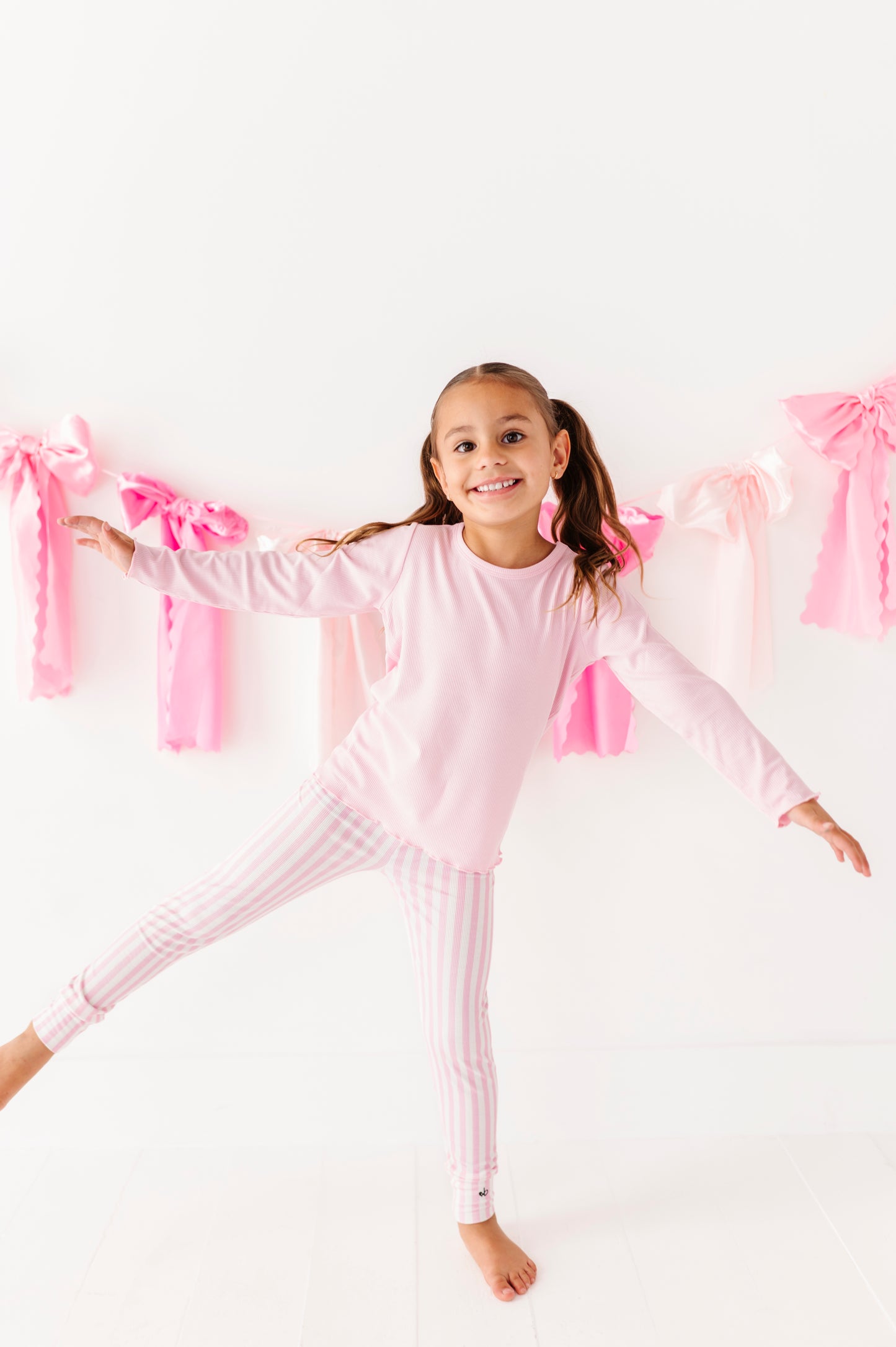 Soft pink ribbed long sleeve top for girls made with bamboo fabric