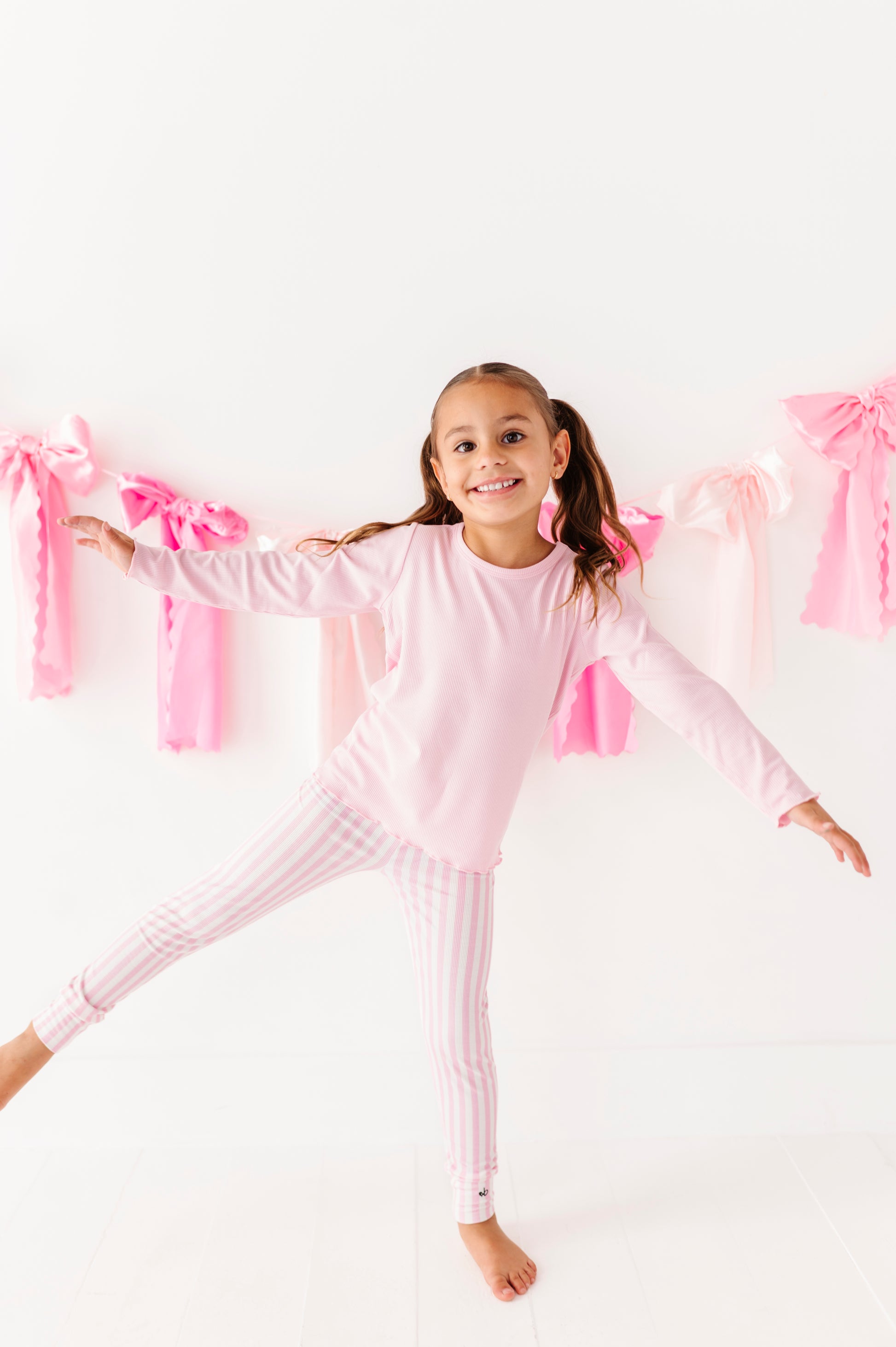 Soft pink ribbed long sleeve top for girls made with bamboo fabric