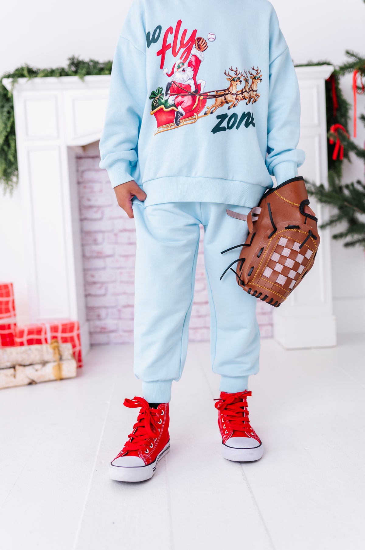 A close-up of light blue bamboo joggers with a baseball crewneck 