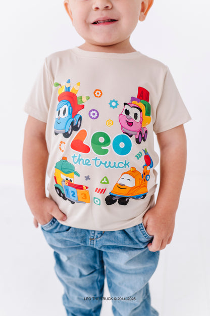 Child wearing a bamboo t-shirt with Leo the Truck and crew characters on a plain background