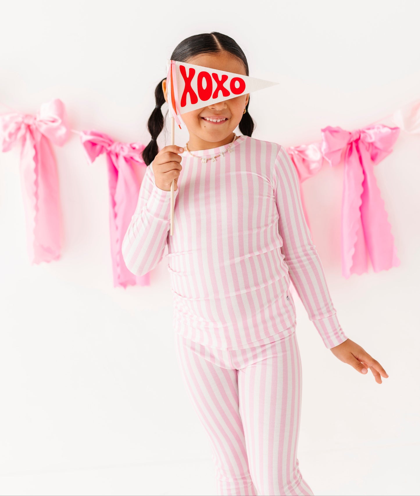 Pink stripe ribbed bamboo pajamas for kids by Birdie Bean