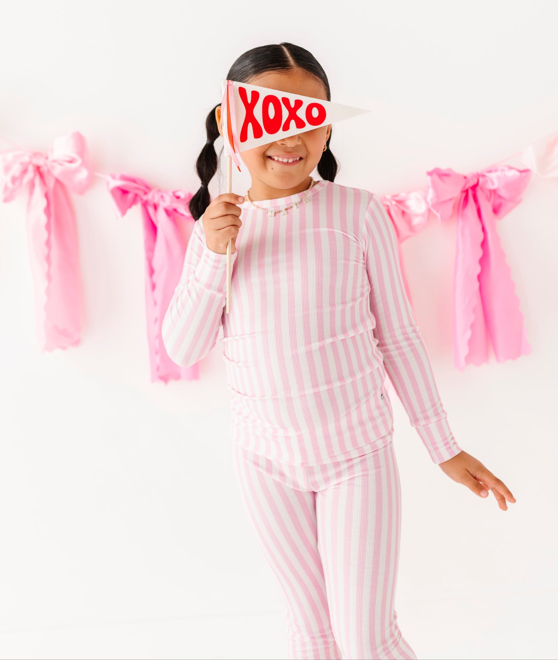 Pink stripe ribbed bamboo pajamas for kids by Birdie Bean