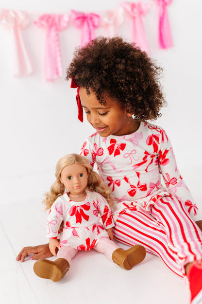 Matching Blushing Bows peplum top shown on toddler and doll