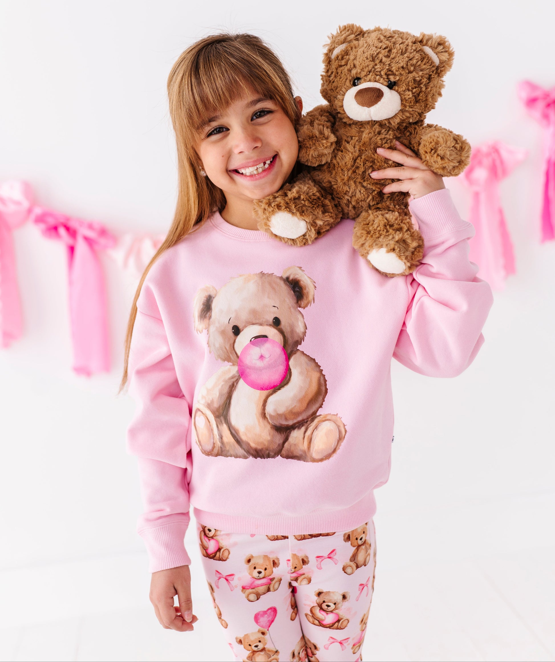 Pink kids crewneck sweatshirt with teddy bear graphic and bubblegum pink detail