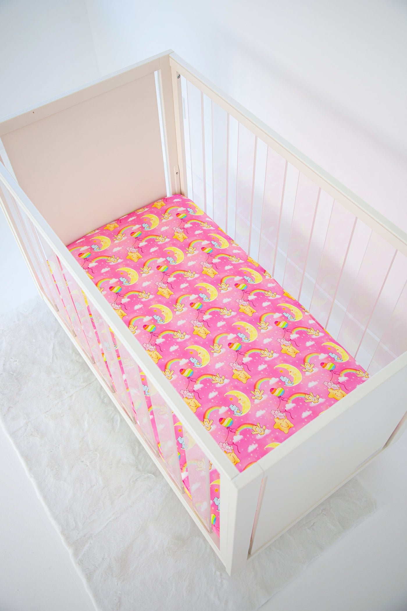 Care Bears Baby™ pink stars crib sheet