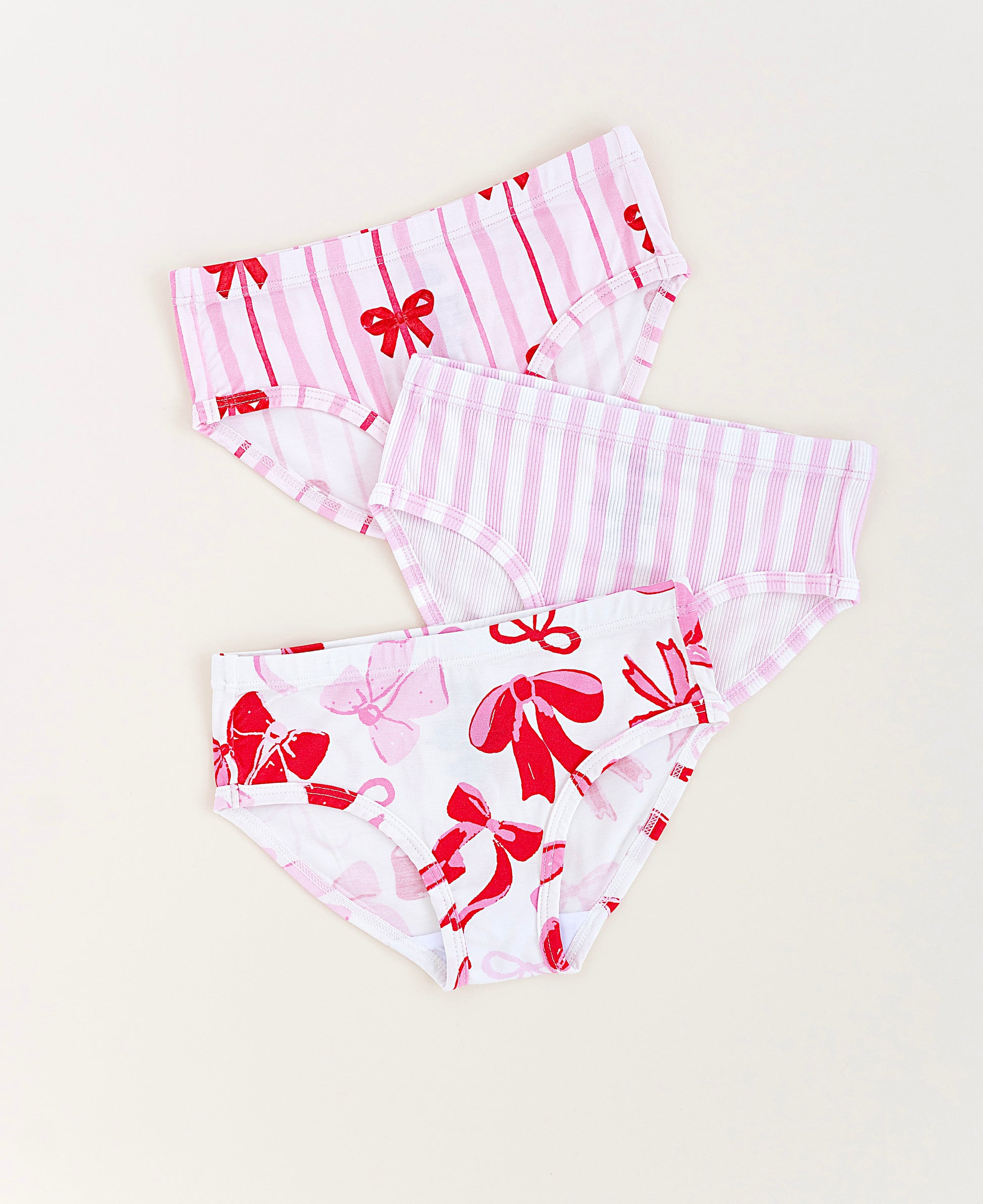 Girls bamboo underwear set featuring Blushing Bows print and pink stripes