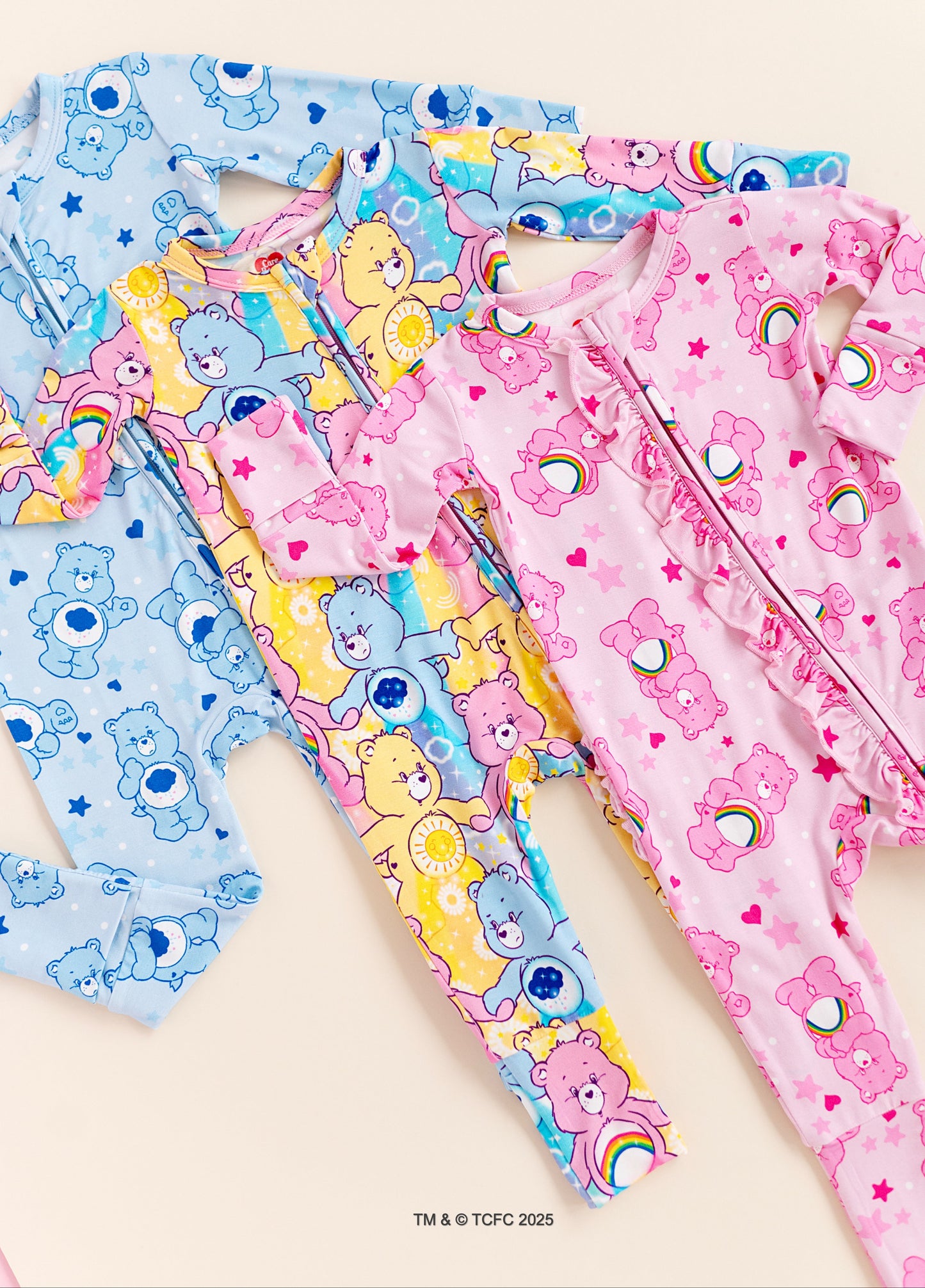 Flat lay of Care Bears™ Stare convertible bamboo romper with bold pastel colors and character print
