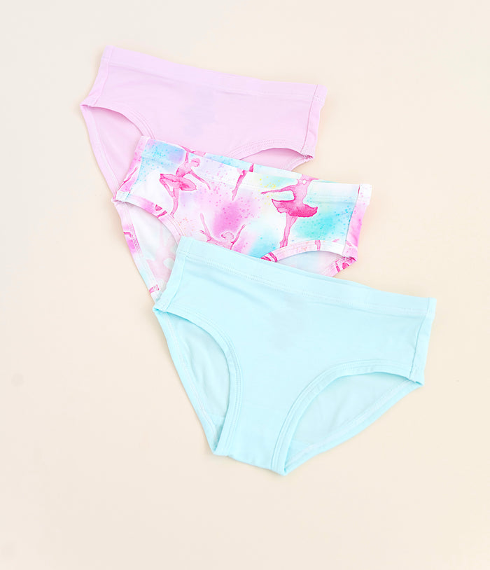 Three pairs of bamboo underwear on a beige background.
