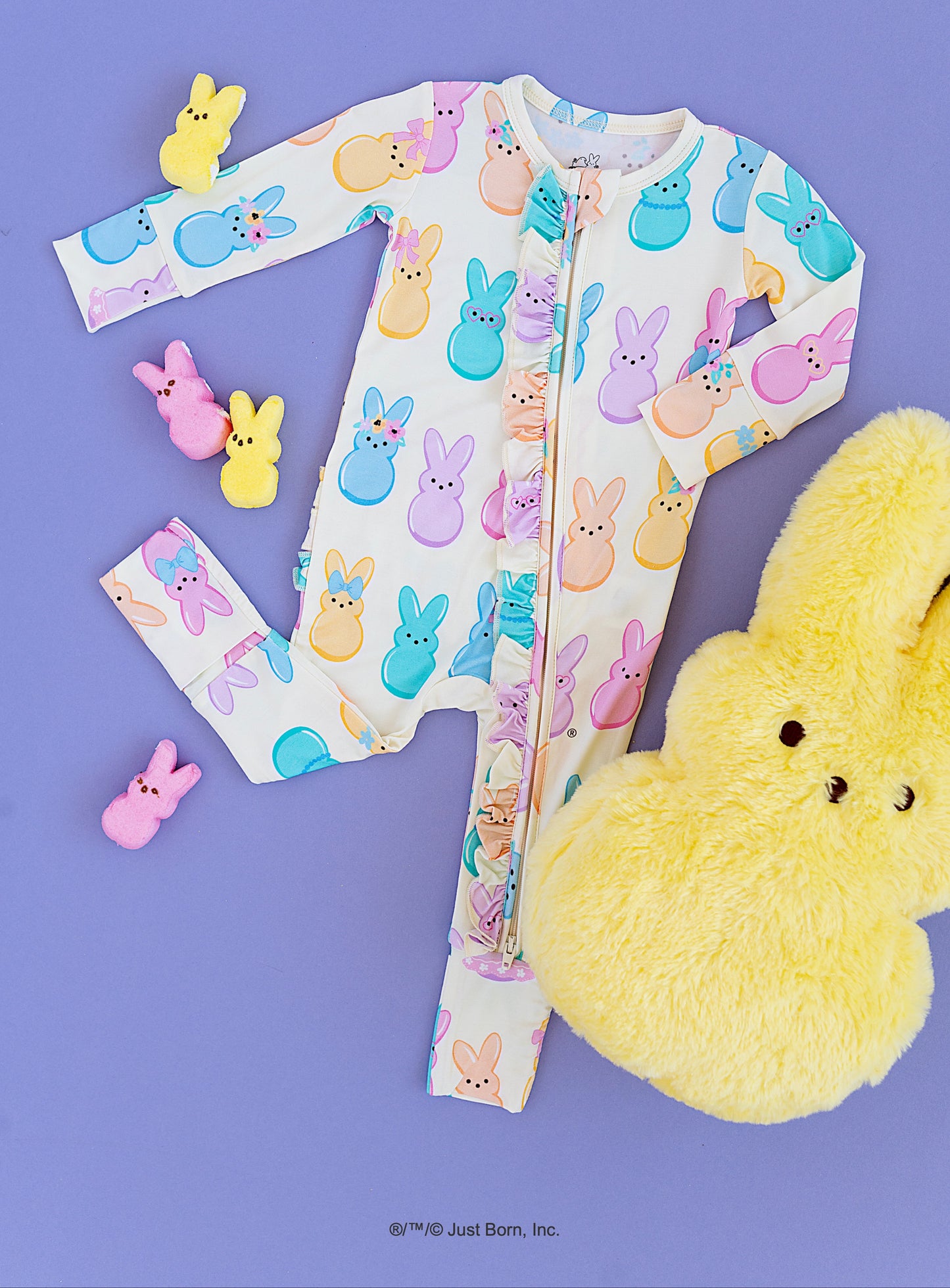 Children's onesie with Peeps character pattern on a purple background