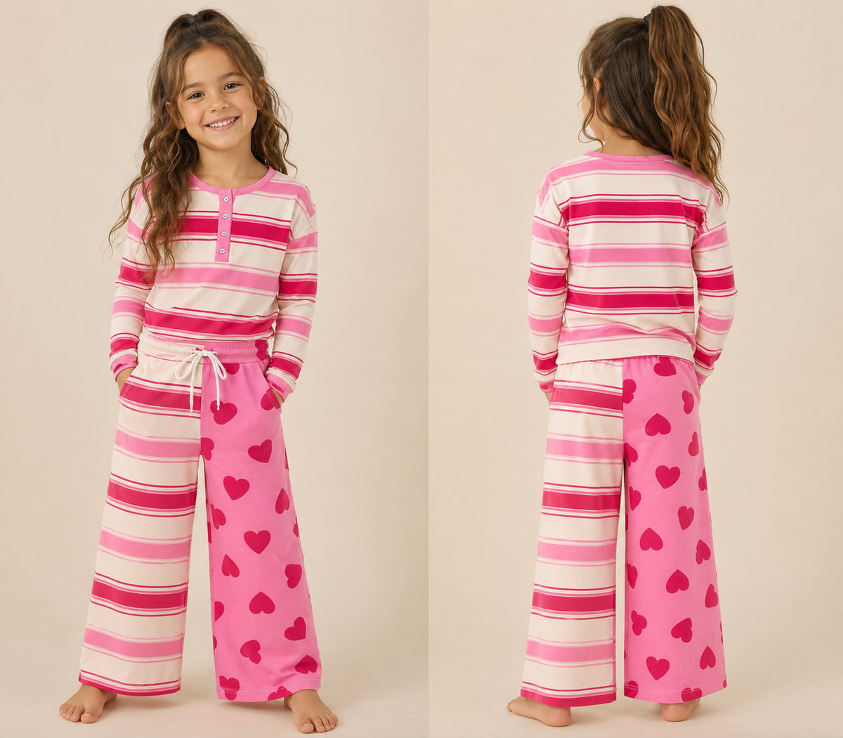 A young girl modeling a two-piece pajama set in a side-by-side front and back view. The set features a long-sleeve henley top with pink, magenta, and cream horizontal stripes, paired with matching wide-leg pants that are pink with dark pink hearts on one leg and solid pink with lighter pink hearts on the other.