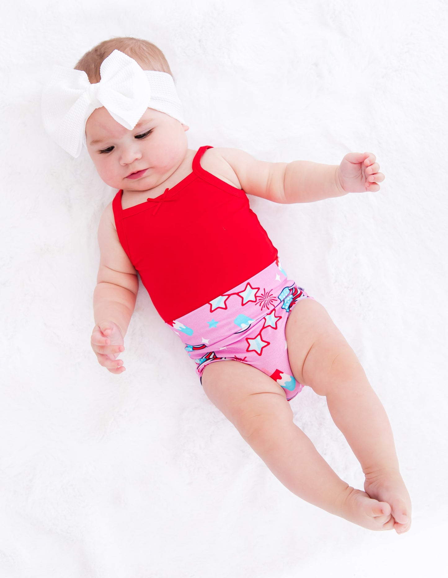 White infant headwrap designed to stay secure and comfortable