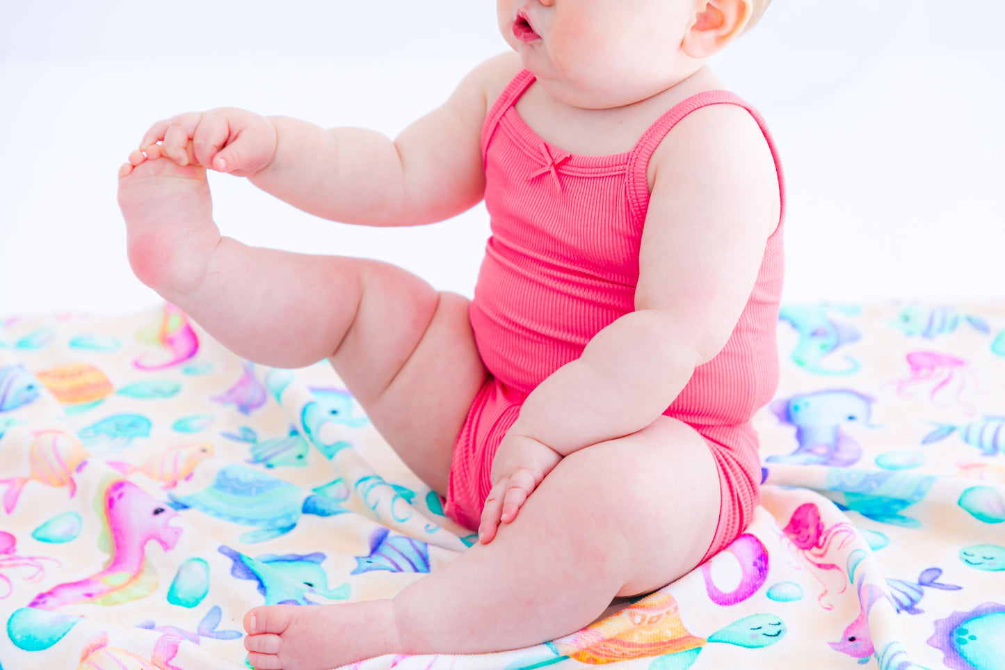Sleeveless bamboo baby bodysuit tank with soft ribbed texture