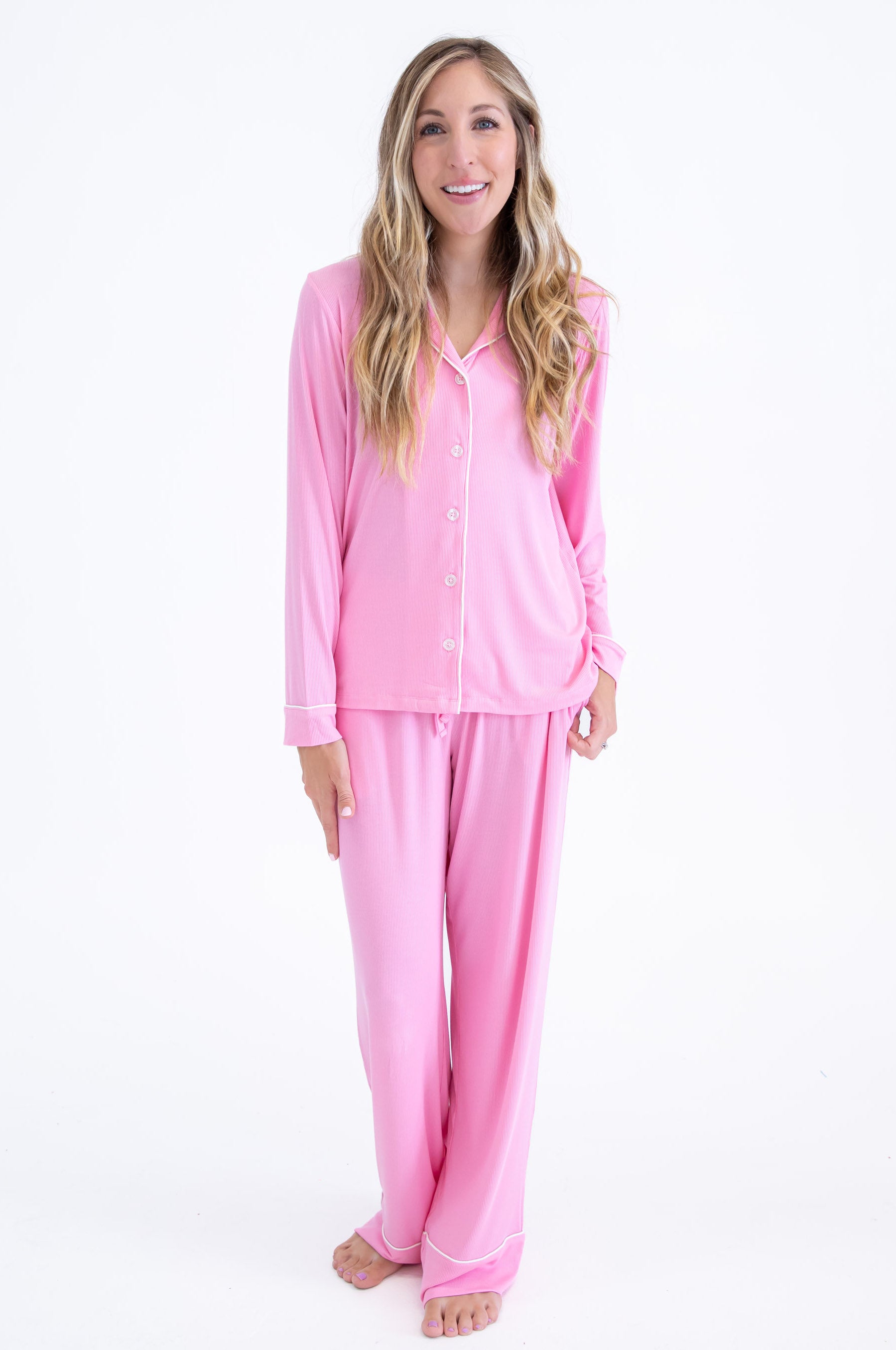 Mom wearing a pink button down pajama set