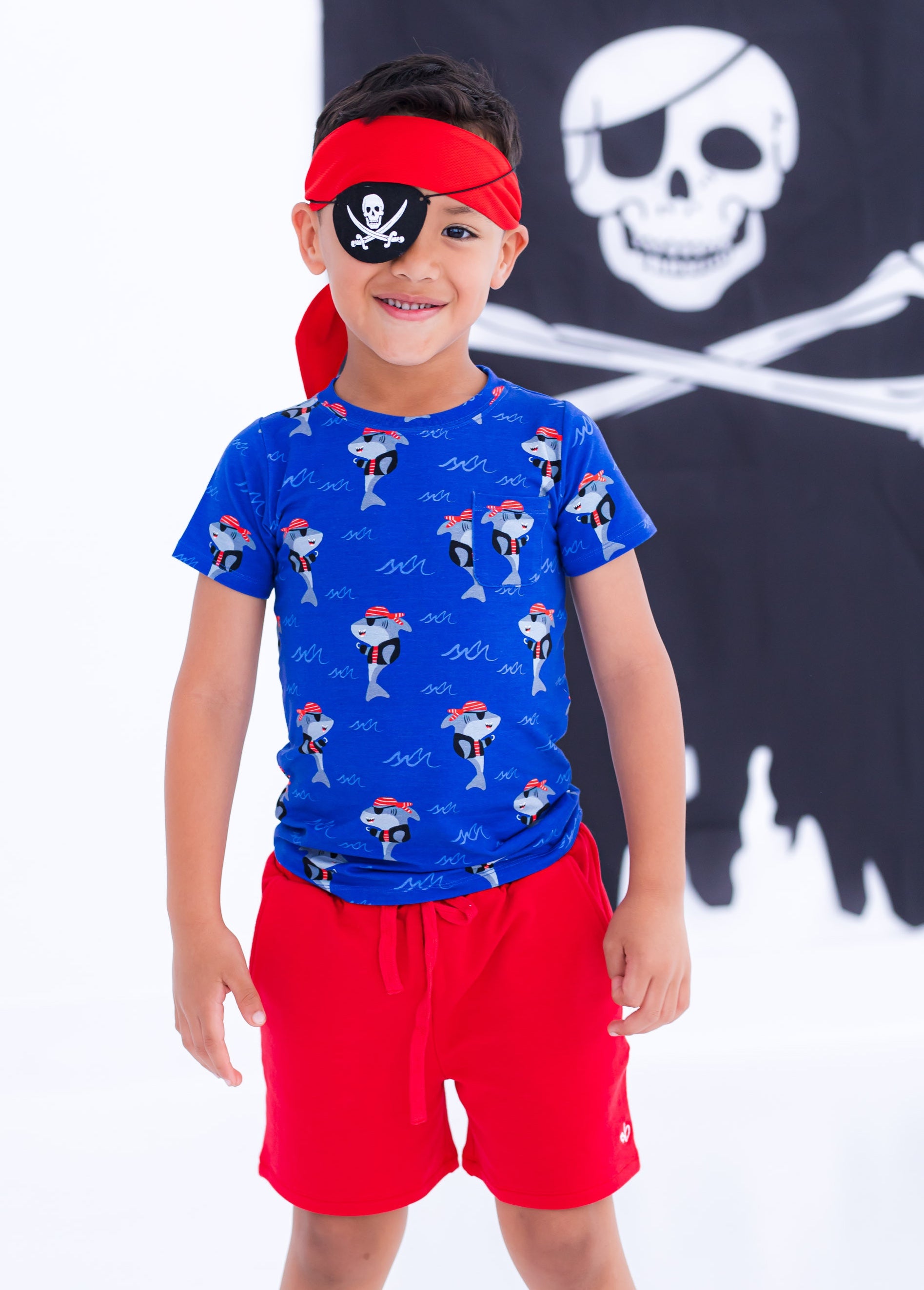 Child wearing Sebastian pirate shark pocket t-shirt styled for play
