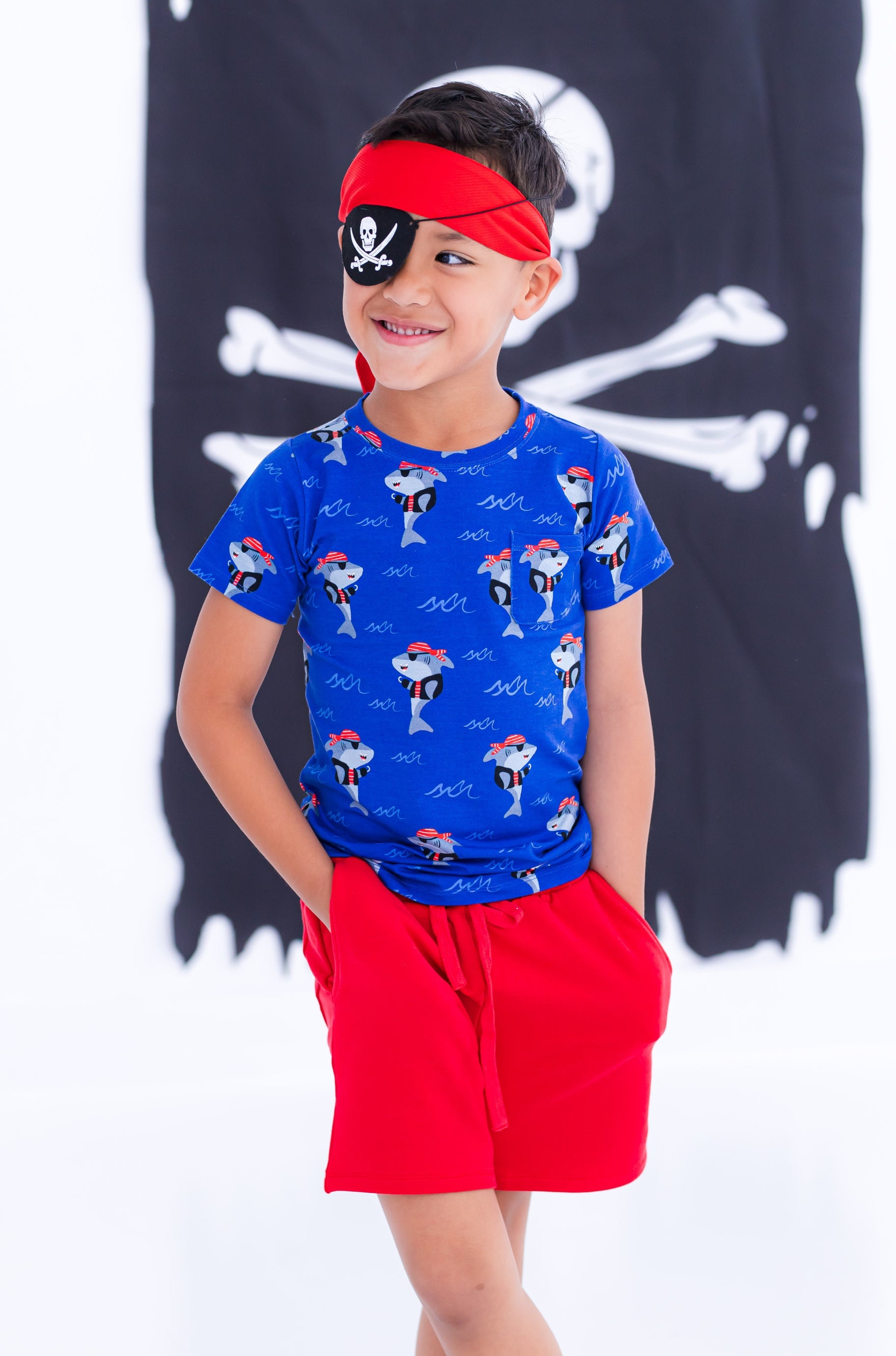 Child wearing Sebastian pirate shark pocket t-shirt styled for play