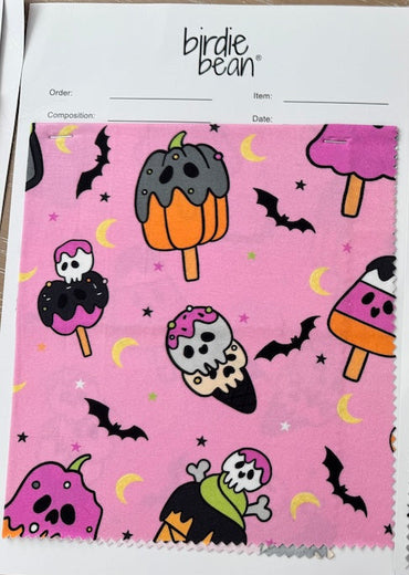 Two fabric swatches with Halloween-themed designs on a white background.
