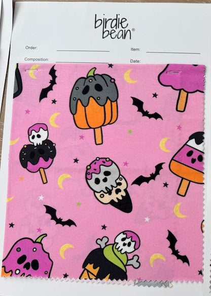 Two fabric swatches with Halloween-themed designs on a white background.