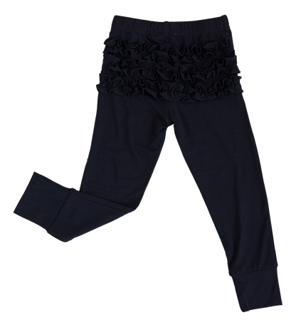 Back view of black bamboo leggings showing ruffle detail on toddler size