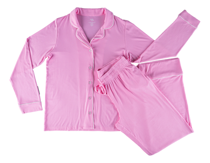 A pink bamboo lounge set, consisting of a long-sleeved top and pants with an elastic waist and adjustable drawstrings, laid flat on a plain background.
