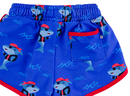 Sebastian Swim Shorties flat lay featuring functional back pocket, elastic waistband, and shark print