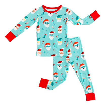 Children's bamboo pajama set with Santa Claus pattern on a light blue background