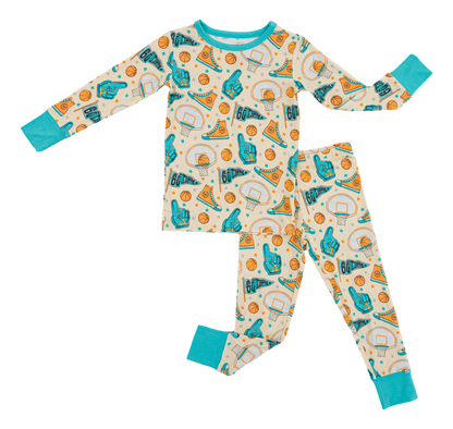 Children's bamboo pajama set with sports-themed pattern on a white background